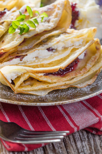 istock Crepes with ricotta cheese and blackcurrant jam. 1216261279