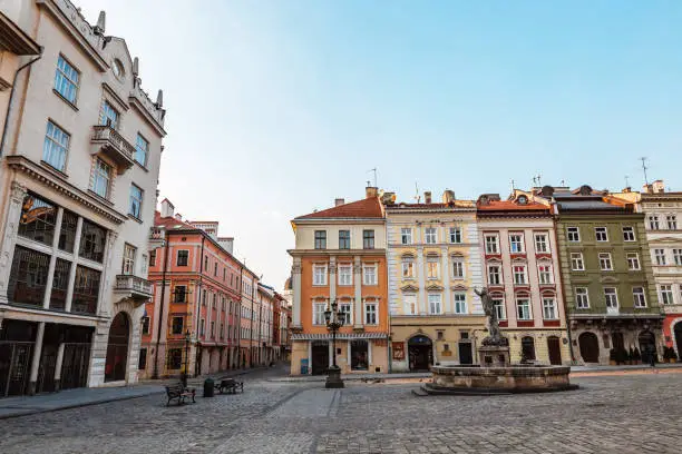 View of the old building of the European city of Lviv at sunset. Without people, no people, empty streets. Travel destination.