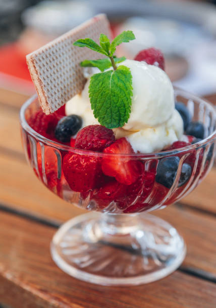 istock Ice cream cup with fruits 1216267073