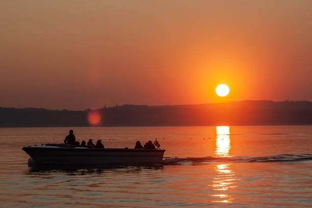 istock beautiful sunset over the lake sunlight reflection 1216267497