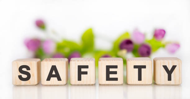 istock Concept SAFETY on cubes in the background flowers 1216268655