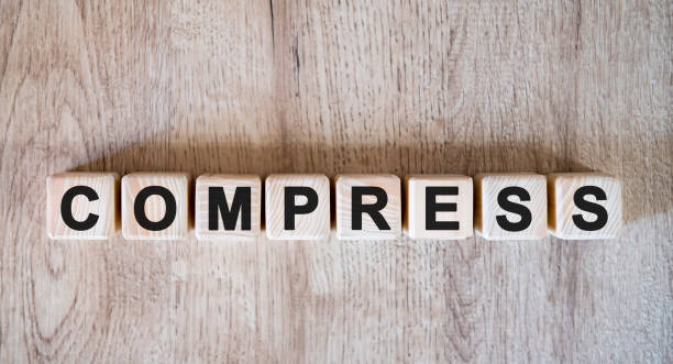 istock COMPRESS text word on wooden cubes on wooden background 1216268714
