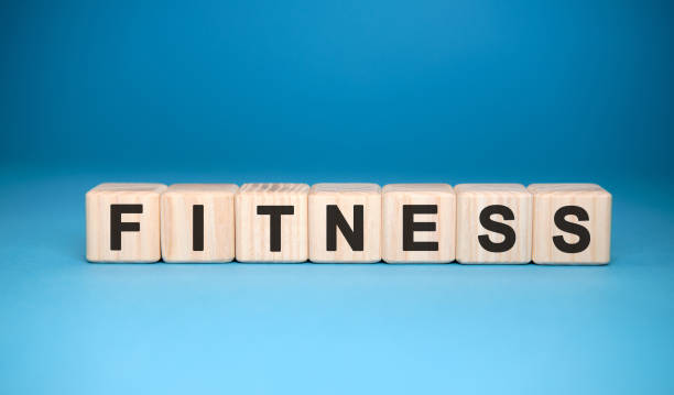 istock FITNESS word cube on a blue background. Medical concept. 1216268735