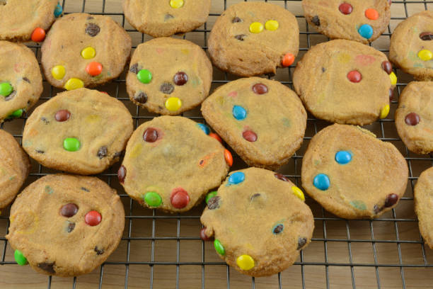 istock Batch of candy covered chocolate piece cookies 1216269211