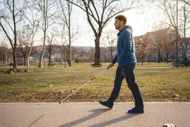 istock Blind man enjoying a calm walk outdoors 1216271492