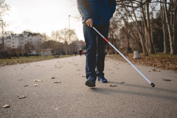 istock Blind man enjoying a tranquil morning walk 1216271501