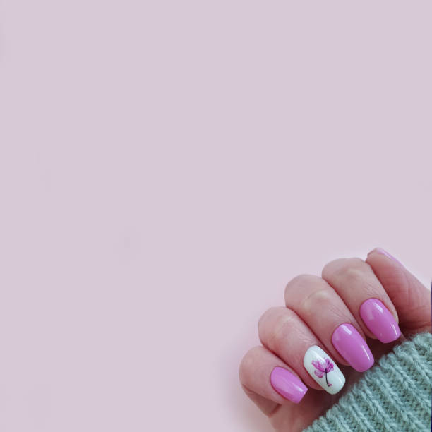 istock female hand beautiful manicure sweater 1216273506