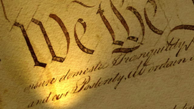 High resolution video with focus on a portion of the US Constitution text.