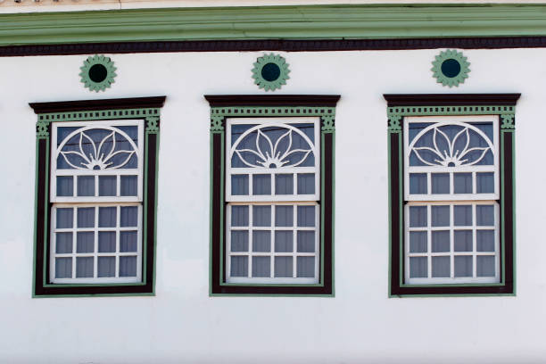 Colorful windows of a colonial house in the historical town of Paracatu, Minas Gerais, Brazil