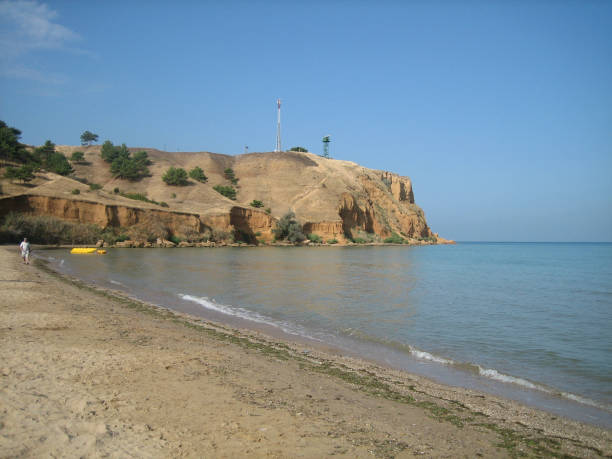 istock Sandy beach in quiet Sunny weather. Weak surf caressing the coastal sand. 1216277112