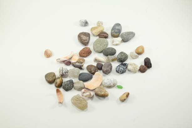 istock pebbles collected from the sea on a white background 1216277258