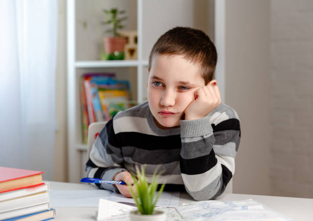 istock Online education distance learning. Schoolboy doing school homework 1216278224