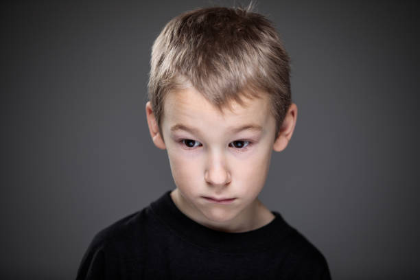 istock Grief-stricken little boy 1216278256