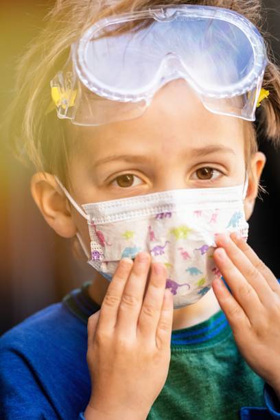 istock Caucasian boy posing with a protective mask, protective glasses 1216278371