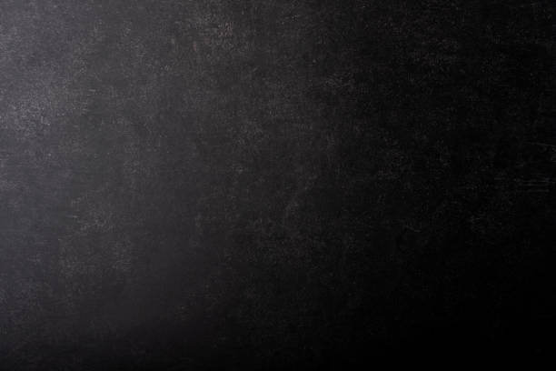 istock Black gray painted concrete texture or background with grain elements. High contrast and resolution image with place for text. Template for design 1216279125