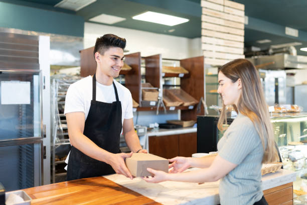 Customer buying some bread at a shop