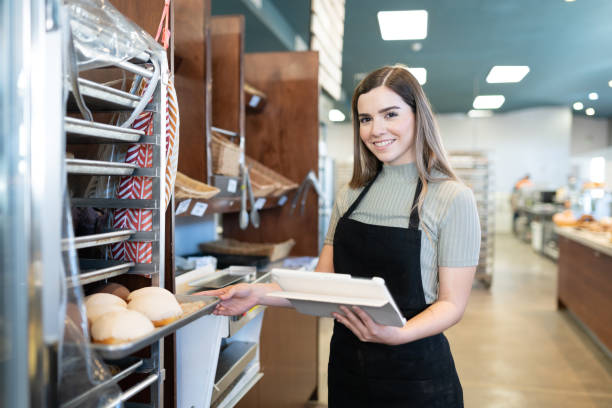 istock Happy worker in a bakery shop 1216280272