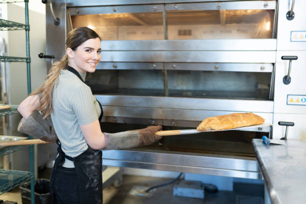 istock Young woman baking some bread 1216281251