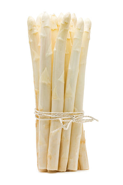 istock Fresh cut white asparagus tied together 121628418