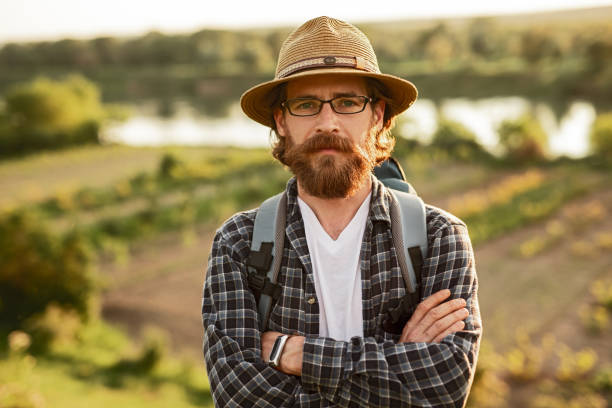 istock Confident tourist standing in countryside 1216291414