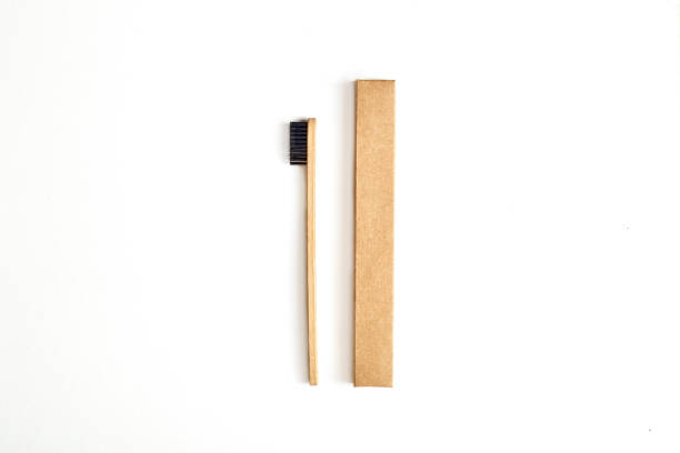 istock Flat lay of paper case and ecological bamboo toothbrush 1216291601