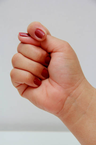 istock woman's hand in the shape of a fig 1216293499