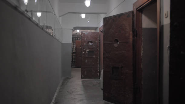 istock Dark prison corridor, old walls, scary atmosphere 1216308113