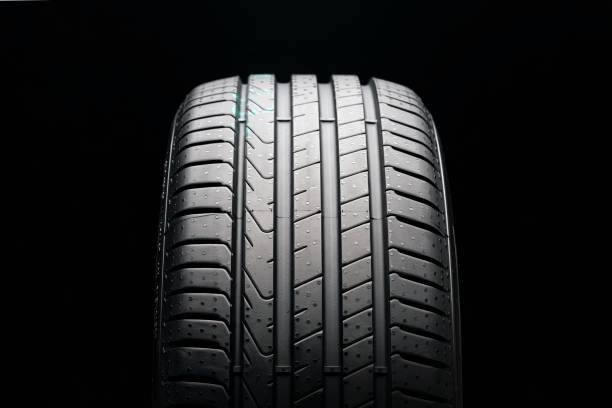 istock new summer tire on a black background, front view 1216308747