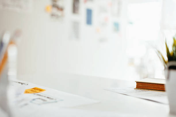 istock View of white desk in modern design office 1216308921