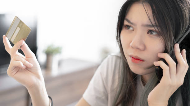 istock Close up of a young woman feeling upset while having banking issue 1216310492