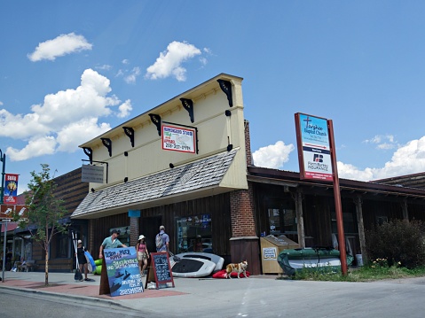 Driggs, Idaho- August 2018: Facade of shops and stores with people walking on the streetside in Driggs.