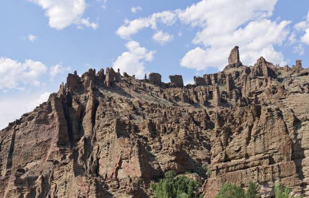 istock Sharp and jagged rock and geological formations seen along North Fork Highway in Wyoming. 1216316804