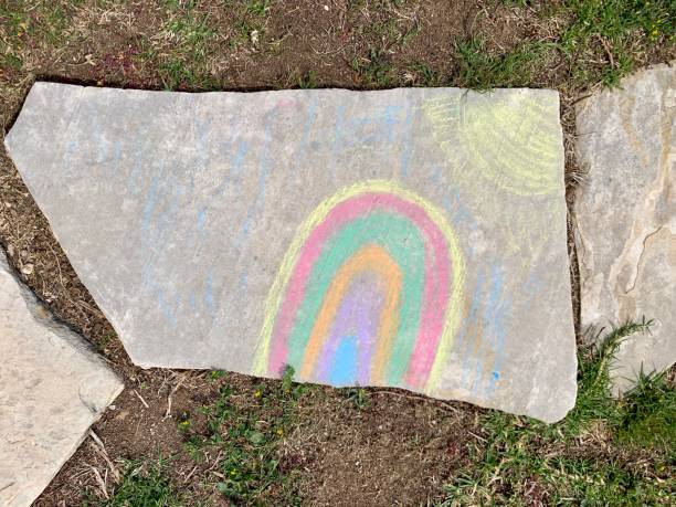 istock Bright rainbow drawn by children by crayons on a track 1216317786