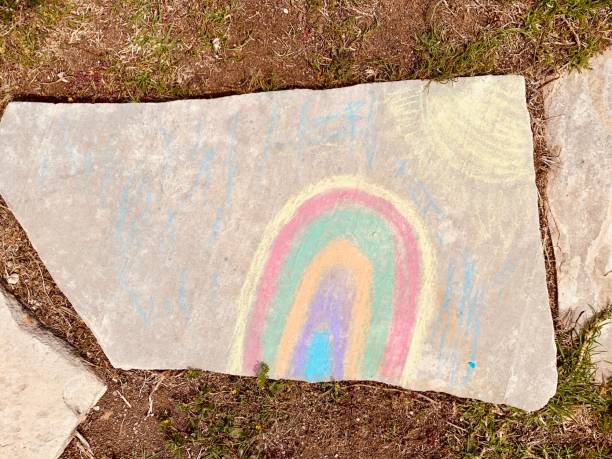 istock Bright rainbow drawn by children by crayons on a track 1216317792