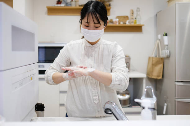 istock Woman washing hands 1216318588
