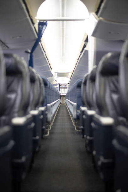 istock Rows of empty first class seats on a commercial airplane. 1216319381
