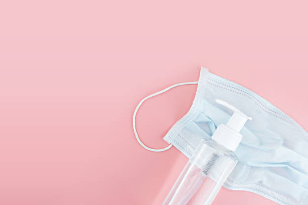 istock Gel alcohol with health masks with copy space 1216322414