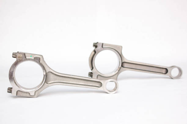 istock Connecting rod from a car engine isolated on white. 1216324386