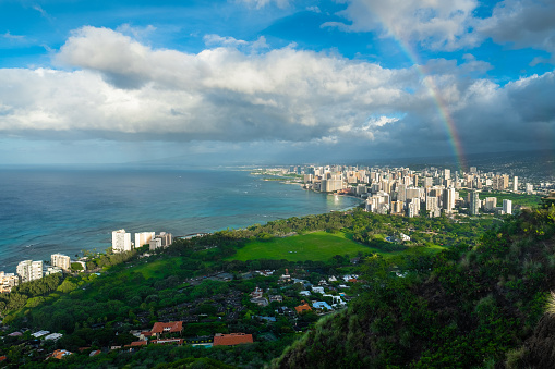 Rainbow and rainy clouds over the city of Honolulu, Oahu, Hawaii