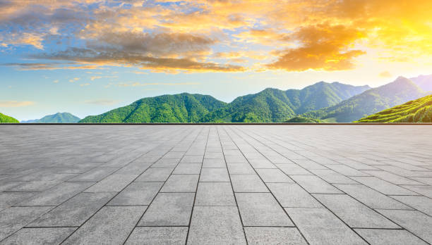 istock Empty floor and green tea mountain nature landscape at sunset. 1216329907