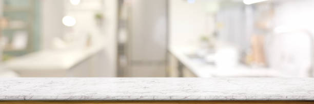 istock Cropped shot of empty marble table in blurred kitchen room 1216330027