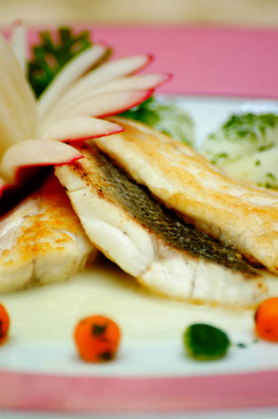 istock Tasty fish dish with fresh vegetables 1216330839