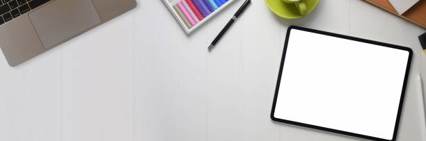 istock Top view of designer workspace with computer devices, designer supplies and copy space 1216331136