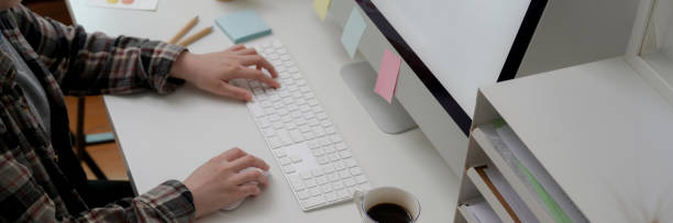istock Side view of female graphic designer working with computer on office desk 1216332511