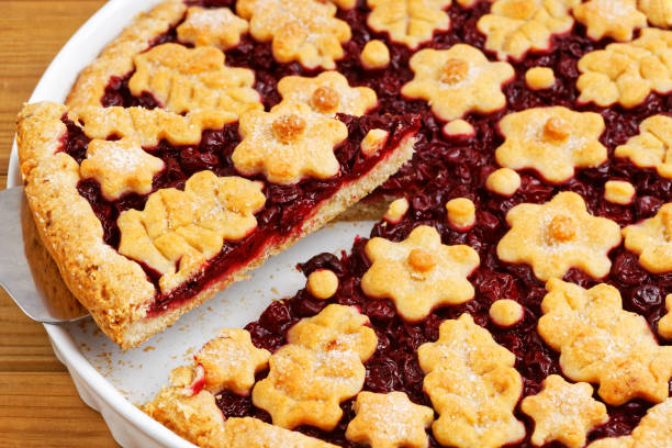istock Closeup homemade cherry pie crostata on wooden table. Angle view. 1216333420