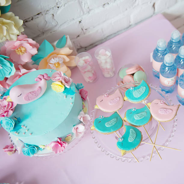 istock A beautiful cake decorated with pink bird topper. 1216333436