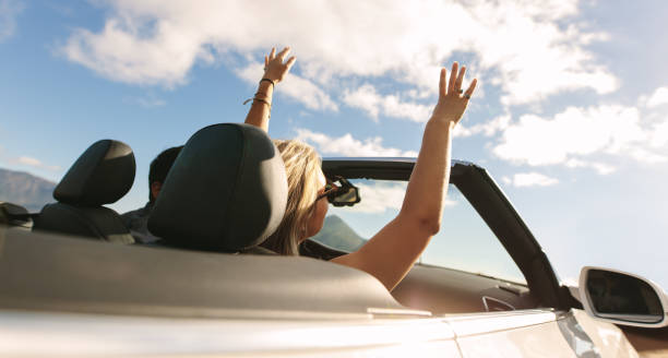 istock Couple enjoying themselves on a long drive 1216337415