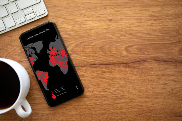 phone with live map global spread of virus on the screen