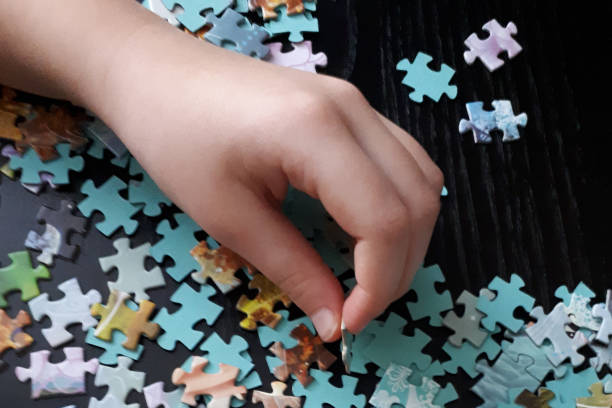 istock children's hand collect puzzles 1216347597