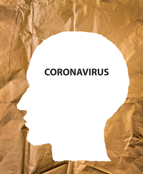 istock Crumpled paper human head with Coronavirus text. COVID-19 crisis concept. 1216347648